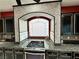 Well-designed kitchen featuring granite countertops and black cabinetry at 6779 Goose Watch Ct, Las Vegas, NV 89139