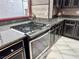 Updated kitchen features stainless appliances, granite counters, and custom cabinetry at 6779 Goose Watch Ct, Las Vegas, NV 89139