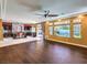 Open-concept living room with hardwood flooring connecting kitchen area at 6779 Goose Watch Ct, Las Vegas, NV 89139