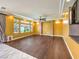 Bright living room featuring hardwood floors, recessed lighting, and large windows at 6779 Goose Watch Ct, Las Vegas, NV 89139