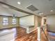 Living room with hardwood floors, recessed lighting, and staircase at 6779 Goose Watch Ct, Las Vegas, NV 89139
