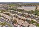 Neighborhood aerial featuring houses and landscaping near an equestrian center and desert terrain at 7641 Sea Wind Dr, Las Vegas, NV 89128