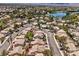 Gorgeous aerial shot of community featuring a lake and mature trees at 7641 Sea Wind Dr, Las Vegas, NV 89128