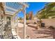 Relax on the patio in a low-maintenance backyard with pergola shade at 7641 Sea Wind Dr, Las Vegas, NV 89128