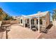 Cozy backyard showcases a brick patio, pergola, and manicured landscape at 7641 Sea Wind Dr, Las Vegas, NV 89128