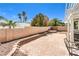 Charming backyard with brick patio, mature trees, and low-maintenance landscaping at 7641 Sea Wind Dr, Las Vegas, NV 89128