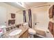 Well-lit bathroom features granite counters and a shower-tub combo at 7641 Sea Wind Dr, Las Vegas, NV 89128