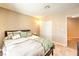 Comfortable bedroom with natural light, large window, and a ceiling fan at 7641 Sea Wind Dr, Las Vegas, NV 89128
