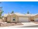 Inviting single-story home with desert landscaping and a convenient two-car garage at 7641 Sea Wind Dr, Las Vegas, NV 89128