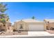 Charming single-story home featuring a well-manicured yard and a two-car garage at 7641 Sea Wind Dr, Las Vegas, NV 89128
