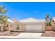 Attractive single-story home boasting a tidy front yard and an attached two-car garage at 7641 Sea Wind Dr, Las Vegas, NV 89128