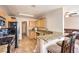 Functional kitchen with updated countertops, stainless steel appliances, and breakfast bar seating at 7641 Sea Wind Dr, Las Vegas, NV 89128