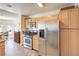 Spacious kitchen featuring stainless steel appliances, wood cabinetry, and granite countertops at 7641 Sea Wind Dr, Las Vegas, NV 89128