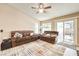 Spacious living room featuring comfortable seating and sliding doors to the backyard at 7641 Sea Wind Dr, Las Vegas, NV 89128
