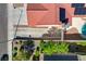 Bird's eye view of home's tile roof, solar panels, desert landscape, and refreshing pool at 7805 Leavorite Dr, Las Vegas, NV 89128