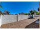 Backyard with desert landscaping surrounded by a secure block wall at 7805 Leavorite Dr, Las Vegas, NV 89128