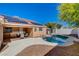 Inviting backyard featuring a private pool, patio, and desert landscaping at 7805 Leavorite Dr, Las Vegas, NV 89128