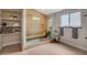 Modern bathroom featuring glass-enclosed shower with dual showerheads and built-in shelving at 7805 Leavorite Dr, Las Vegas, NV 89128