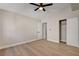 Bedroom with wood-look floors, closet with sliding doors, and an interior door at 7805 Leavorite Dr, Las Vegas, NV 89128