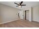 Bedroom with wood-look floors, closet with sliding doors, and an interior door at 7805 Leavorite Dr, Las Vegas, NV 89128