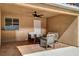 Relaxing covered patio with an outdoor seating area and view of the backyard at 7805 Leavorite Dr, Las Vegas, NV 89128