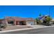 Attractive home featuring a red tile roof, mature landscaping, and a spacious driveway at 7805 Leavorite Dr, Las Vegas, NV 89128