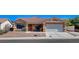 Charming single-story home with well-maintained landscaping and a two-car garage at 7805 Leavorite Dr, Las Vegas, NV 89128