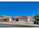 Suburban home with low maintenance desert landscaping, and a long driveway at 7805 Leavorite Dr, Las Vegas, NV 89128
