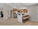 Modern kitchen with stainless steel appliances, marble counters, and a breakfast bar with seating at 7805 Leavorite Dr, Las Vegas, NV 89128
