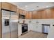 Kitchen with stainless steel appliances, white cabinets, and light countertops at 7805 Leavorite Dr, Las Vegas, NV 89128