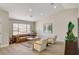 Cozy living room with a comfortable sofa, stylish decor, and a bright atmosphere at 7805 Leavorite Dr, Las Vegas, NV 89128
