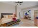 Inviting bedroom with vaulted ceiling, stylish furniture, and access to a closet at 7805 Leavorite Dr, Las Vegas, NV 89128