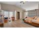Spacious main bedroom with vaulted ceiling, sliding glass doors, and ensuite access at 7805 Leavorite Dr, Las Vegas, NV 89128