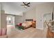 Bright bedroom with vaulted ceiling, barn door to ensuite, and modern decor at 7805 Leavorite Dr, Las Vegas, NV 89128