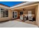 Covered patio area with tiled floor and comfortable seating arrangement at 7805 Leavorite Dr, Las Vegas, NV 89128