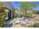 Inviting outdoor patio with modern seating and desert landscaping, ideal for enjoying the peaceful surroundings and serene ambiance at 787 Keyland St, Las Vegas, NV 89138