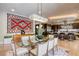 Elegant dining area with a glass table, modern lighting, and seamless flow to the kitchen at 787 Keyland St, Las Vegas, NV 89138