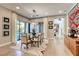 Stylish dining room with glass table, contemporary decor, and outdoor views, perfect for entertaining at 787 Keyland St, Las Vegas, NV 89138