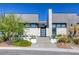 Modern home with sleek architectural lines, desert landscaping, and stylish entrance showcasing contemporary design at 787 Keyland St, Las Vegas, NV 89138
