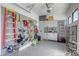 Organized garage features custom storage, shelving, and a slat wall system, maximizing space and keeping tools neatly arranged at 787 Keyland St, Las Vegas, NV 89138