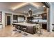 Spacious kitchen with large center island, stainless appliances, wooden floors, and modern design touches throughout the space at 787 Keyland St, Las Vegas, NV 89138