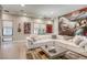 Bright, modern living room featuring a large sectional sofa and eye-catching art at 787 Keyland St, Las Vegas, NV 89138