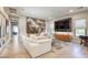Spacious living room with hardwood floors, comfortable seating, and a striking mural at 787 Keyland St, Las Vegas, NV 89138
