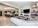 Open-concept living room with modern fireplace and media center flows seamlessly into the kitchen for easy entertaining at 787 Keyland St, Las Vegas, NV 89138