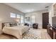 Comfortable bedroom with minimalist design, hardwood floors, and modern furniture at 787 Keyland St, Las Vegas, NV 89138