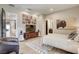 Cozy bedroom features natural light, light hardwood floors, and adjacent bathroom at 787 Keyland St, Las Vegas, NV 89138