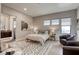 Serene bedroom with minimalist decor, hardwood floors, and en-suite bathroom at 787 Keyland St, Las Vegas, NV 89138