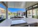 Outdoor kitchen with grill, seating and view of backyard, pool and spa at 787 Keyland St, Las Vegas, NV 89138