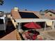 Backyard patio with shade and outdoor dining next to an RV and a solar panel array at 837 Holly Lake Way, Henderson, NV 89002