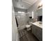 Well-lit bathroom with a shower-tub combo, vanity with sink, and a medicine cabinet for extra storage at 837 Holly Lake Way, Henderson, NV 89002